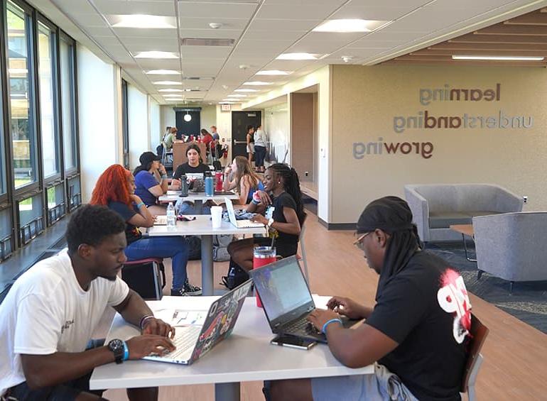 many students studying and chatting in shiple lobby
